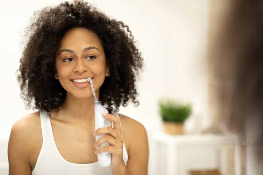 Is Water Flossing Effective? Pros and Cons Versus Regular Flossing