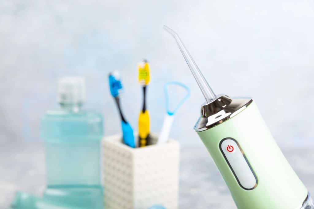 Is Water Flossing Effective? Pros and Cons Versus Regular Flossing